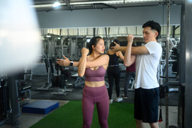 istock Fitness partners stretching before workout at the gym 2196694834