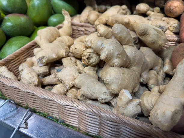 istock Fresh ginger roots displayed in a market among vibrant produce 2196695144