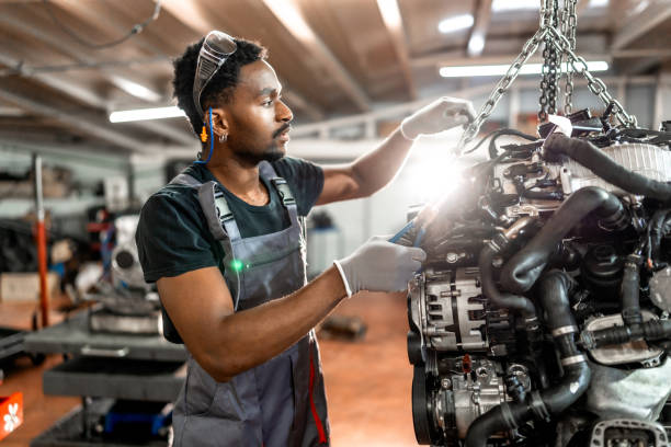 istock Professional mechanic repairing car engine in workshop 2196695326