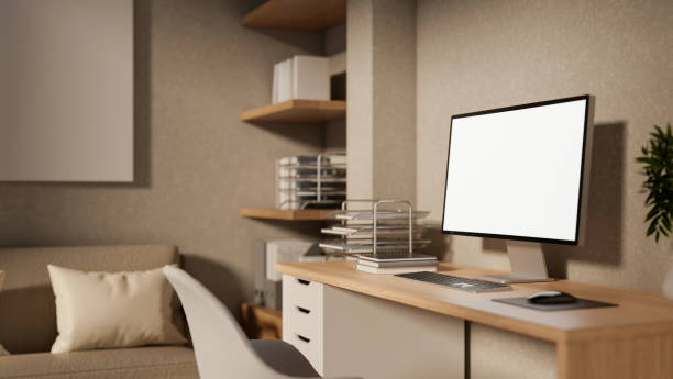 istock A contemporary Scandinavian office workspace featuring a computer on a wooden desk. 2196696093