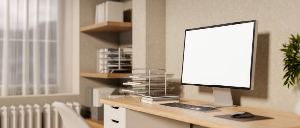 istock A side view of a minimalist Scandinavia home office workspace features a computer on a desk. 2196696188