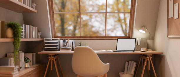 istock A cozy, minimalist woody home office workspace features a laptop on a desk. 2196696398