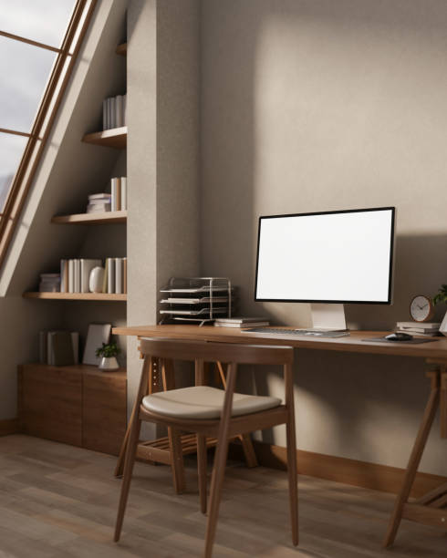 istock A contemporary Scandinavian workspace features a computer placed on a wooden table and sleek decor. 2196696623
