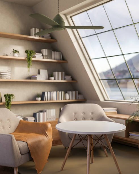 istock A contemporary relaxation corner features modern armchairs and a table by a large starlight window. 2196696699