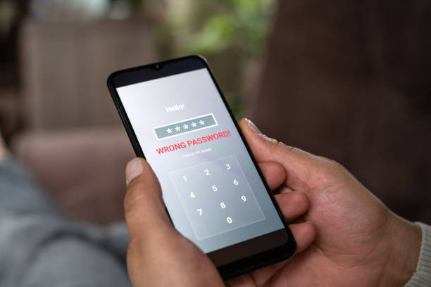 istock Man with smartphone trying to log in. Data security, data leaks and unauthorised access concepts. 2196703945