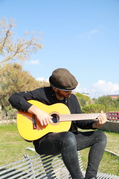istock Playing the Guitar Outdoor to Train the Mind for Concentration and Exercise 2196706496