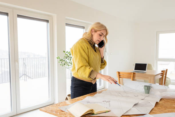 istock Businesswoman Refining Design Plans in a Modern Setting 2196706649
