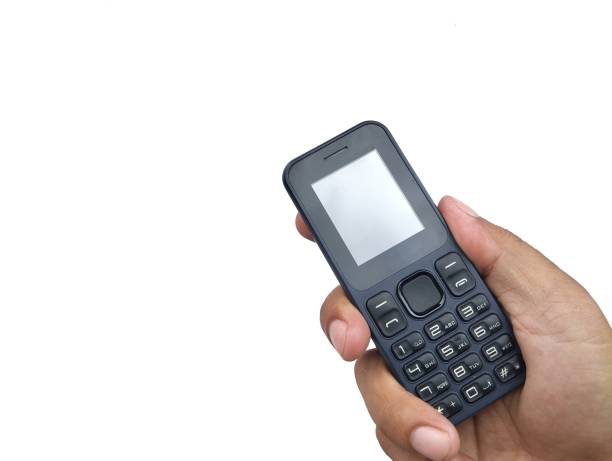 istock Hand holding a old mobile phone isolated on white background 2196708675