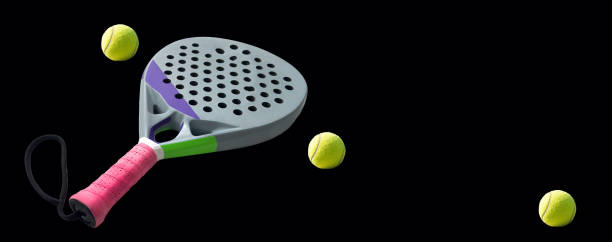 istock padel racket and ball on black background. Top view. 2196709782