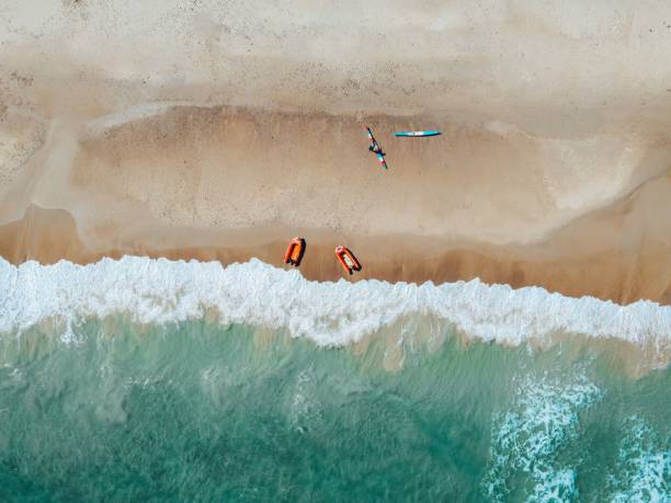 istock Aerial view of beach with kayaks and waves. 2196710133
