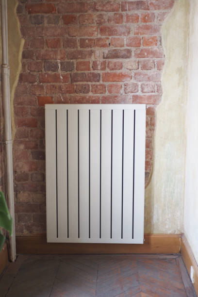 istock An elegant radiator beautifully placed against an exposed brick wall for stunning decor style 2196710533