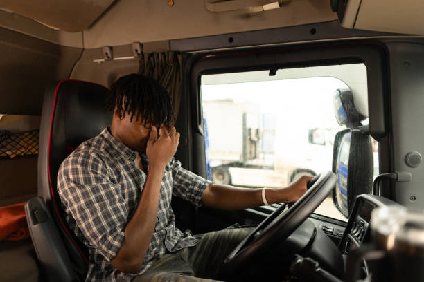 istock Exhausted truck driver on parking lot 2196711246