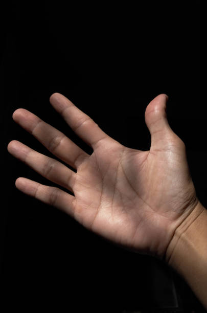 istock hand photo with black background 2196711360