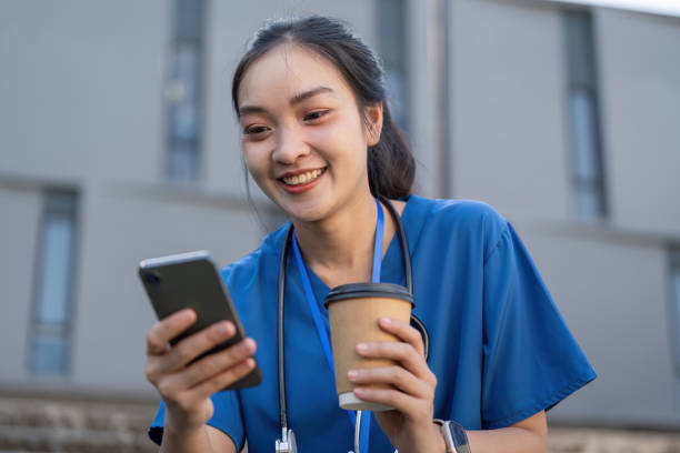 istock Nurse enjoying a coffee break while checking messages on her smartphone in a modern healthcare environment 2196712046