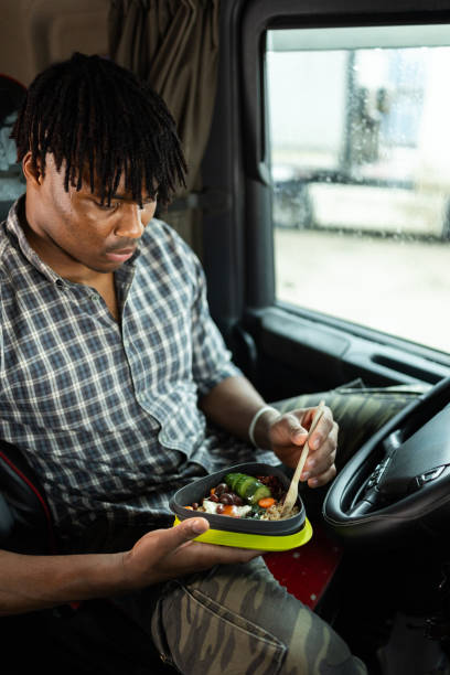 istock Truck driver taking a break for lunch 2196712080