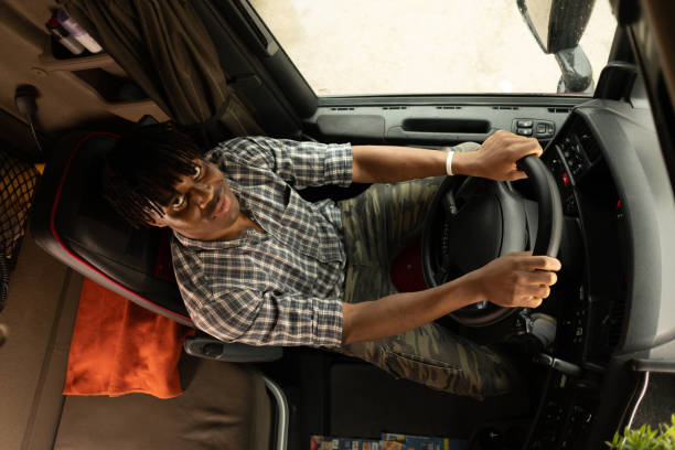 istock Young man driving truck 2196712161