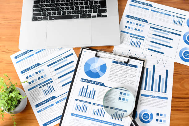 istock Business image of a marketing or analyst with PCs, documents, etc. arranged on the desk 2196715468
