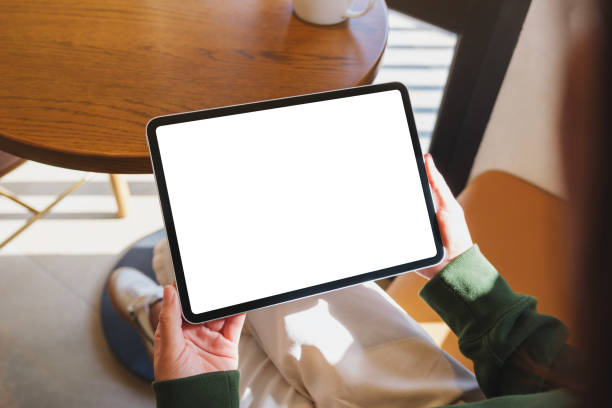 istock Mockup image of a woman holding digital tablet with blank desktop screen 2196715997