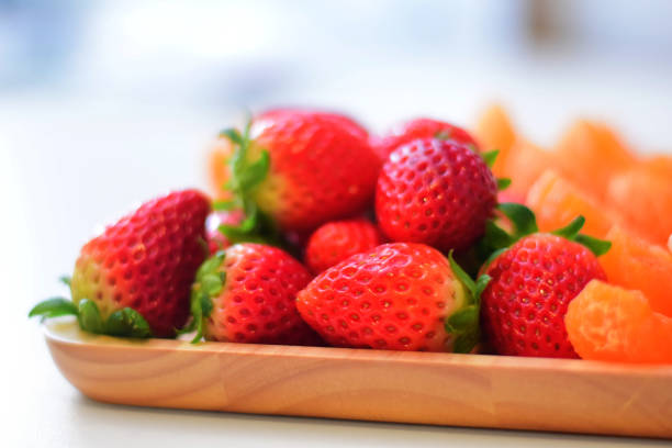 Strawberries with strawberry leaf on a White background.