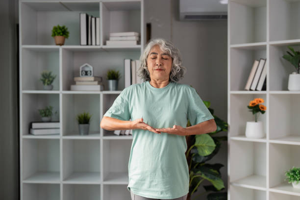 istock Senior Woman Practicing Mindfulness and Relaxation Exercises at Home for Enhanced Wellness and Healthy Living 2196717356