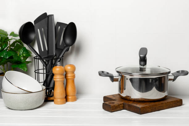 istock Stainless steel saucepan on light kitchen background. Modern saucepan. Kitchenware. Cooking pot. Cooking concept. Mockup. Space for text. Copy space. 2196718399