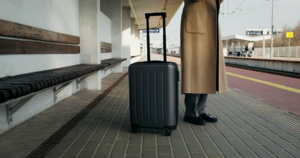 istock A woman at the train station 2196719587