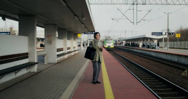 istock A woman at the train station 2196719699