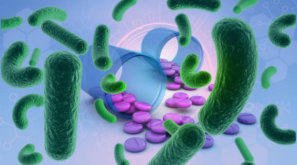 istock Bacteria and medical pills on scientific background 2196719929