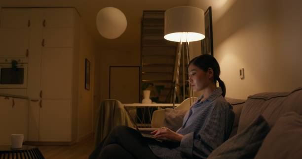 istock A woman with a laptop at home 2196720295