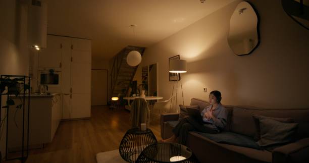 istock A woman uses a laptop at home 2196720947