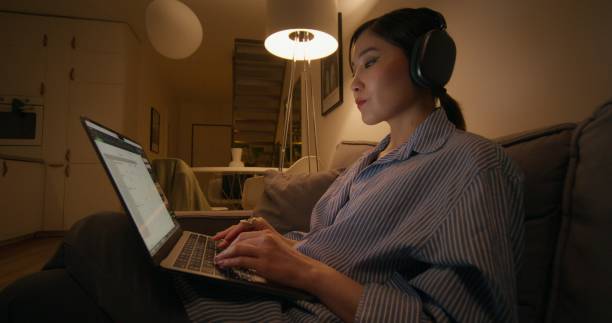 istock A woman uses a laptop at home 2196720957