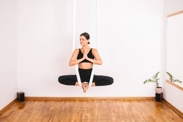 istock Meditating on aerial yoga silk 2196721011
