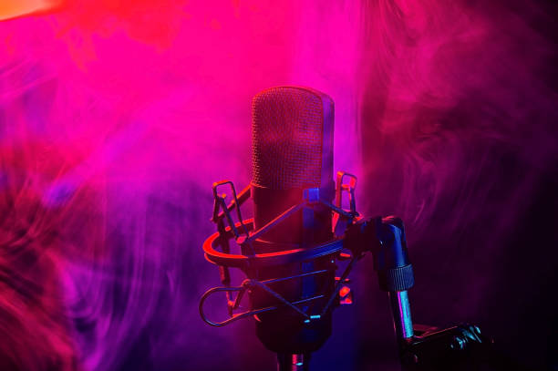 istock Professional microphone in red blue smoke on a black background. 2196721191