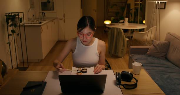 istock A woman eats rolls at home 2196721244