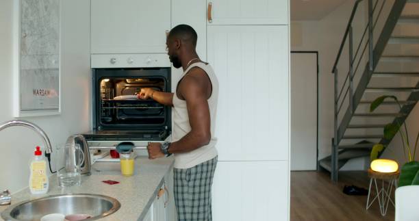 istock A man sits down to have breakfast at home 2196721924
