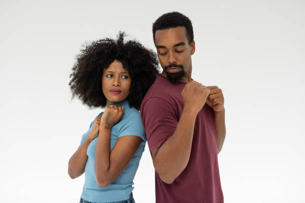istock Couple Standing Back to Back in Studio Photography 2196722002