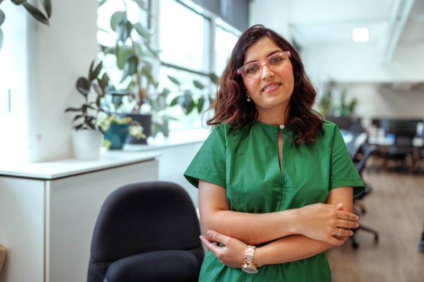 istock Businesswoman posing for camera at the modern office 2196722631