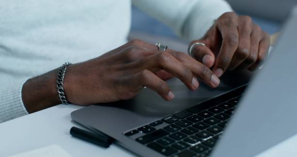 istock A man uses a laptop at home 2196722722