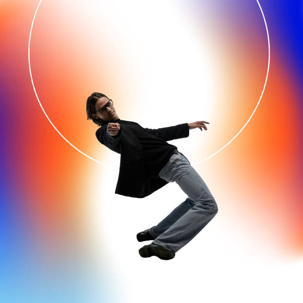 istock Dynamic image of stylish young man leaning forward against multicolored gradient background. 2196722761