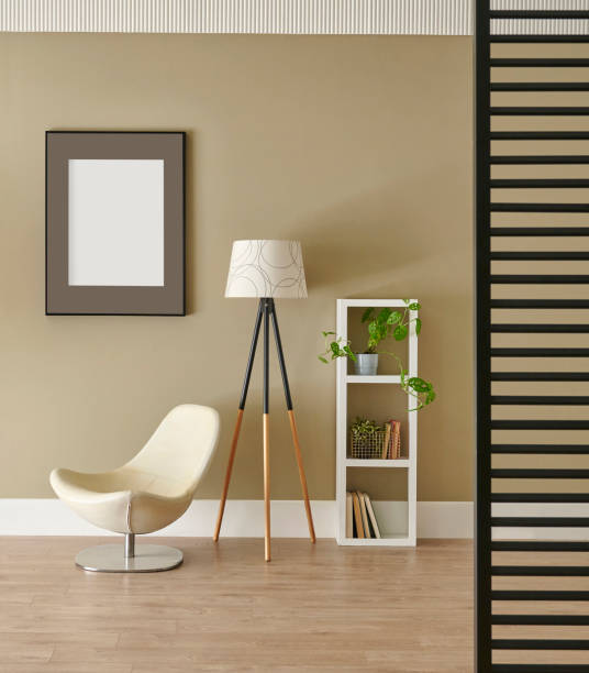istock Decorative modern room wall concept, chair lamp and frame style. 2196722970