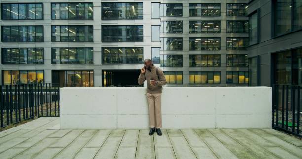 istock A man is talking on a mobile phone in the city 2196724331