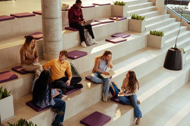 istock University students studying and chatting on modern bleachers 2196730935