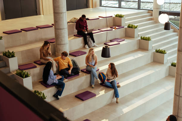 istock University students relaxing and studying in modern bleacher seating area 2196730942