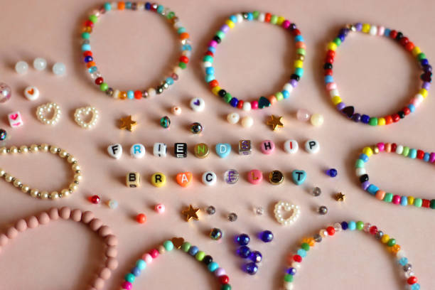 istock Friendship Bracelet Supplies On Pink Background 2196730949