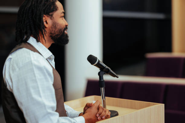 istock Motivational speaker inspiring audience with powerful speech at conference 2196731145