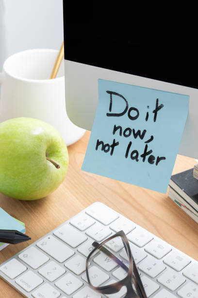 istock Computer Screen with Sticky Note SayingDo It Now, Not Later as a Motivation Reminder 2196731360