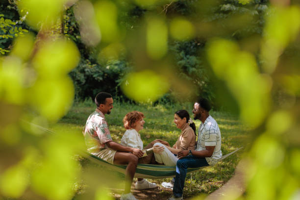 istock Group of friends relaxing on a hammock in nature 2196734478