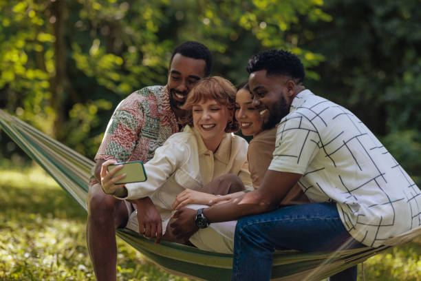 istock Friends taking a selfie in a hammock 2196734483