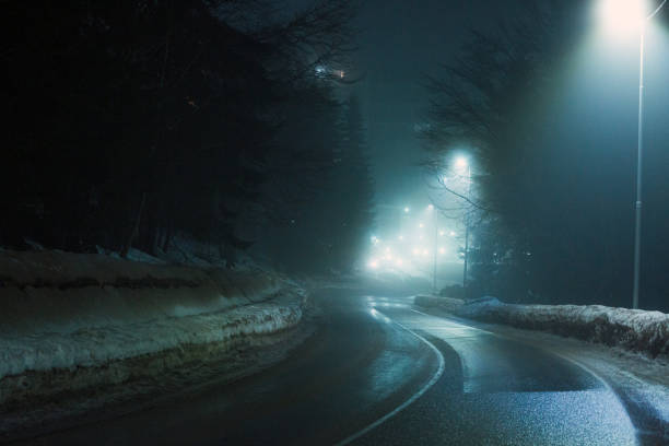istock Difficult foggy and snowy night time for driving 2196735323