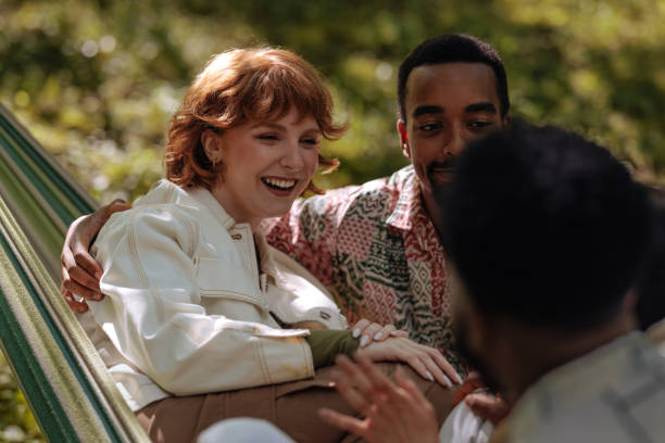 istock Group of friends relaxing in a hammock on a summer day 2196735619